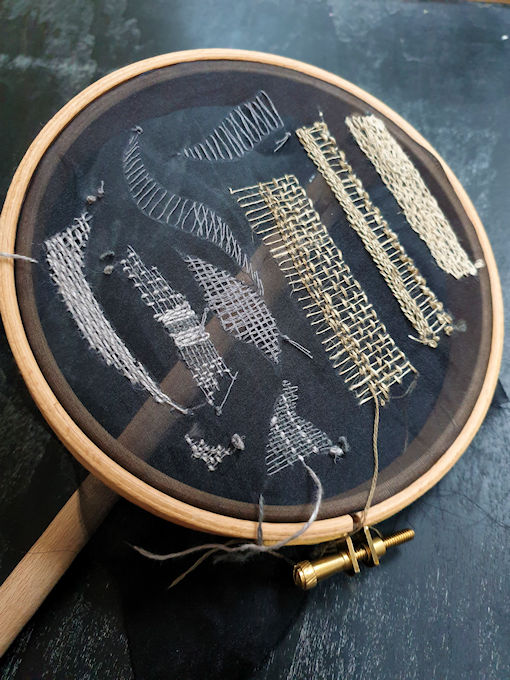 Embroidery hoop with sample stitches
