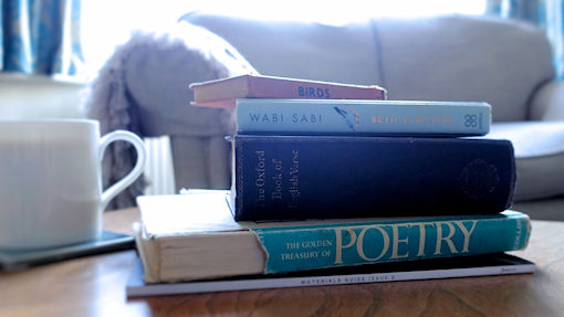 Wabi Sabi by Beth Kempton and other old books on a coffee table