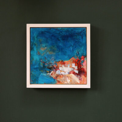 Land of the Gods III shown framed in a limedwood tray frame and hung on the wall. The blues vibrate against the warm orangey browns of the land